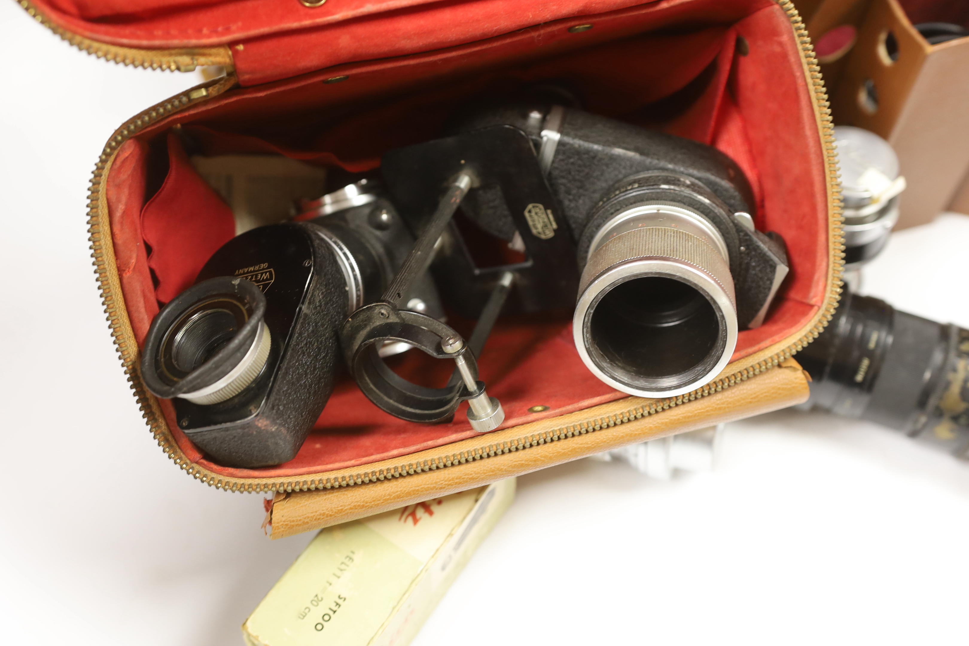 Leica accessories including; a Leitz Visoflex I and Visoflex II, a Summarit f-5cm 1:1.5 lens, an Elmar f=9cm 1:4lens, a Super Angulon 1:4/21 lens, a Range Finder, a Leitz Telyt f=20cm 1:4.5 lens, a Leitz Telyt SFT00 view